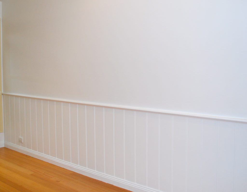 How should you paint wall paneling?