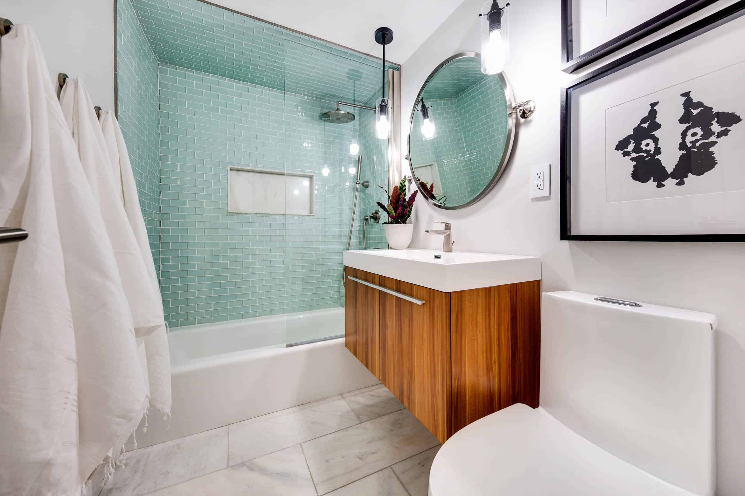 Modern green and white tile bathroom, wooden cabinet