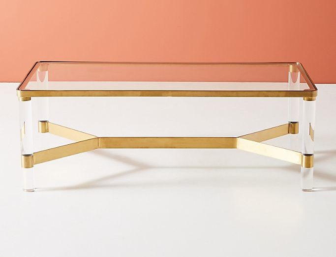 Brass plated steel base, acrylic legs, tempered glass top with rounded corners