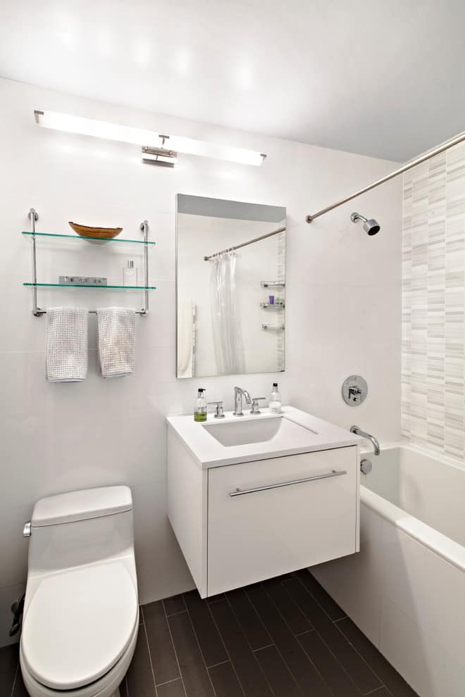 Minimalist bathroom, grey tile floor, white walls