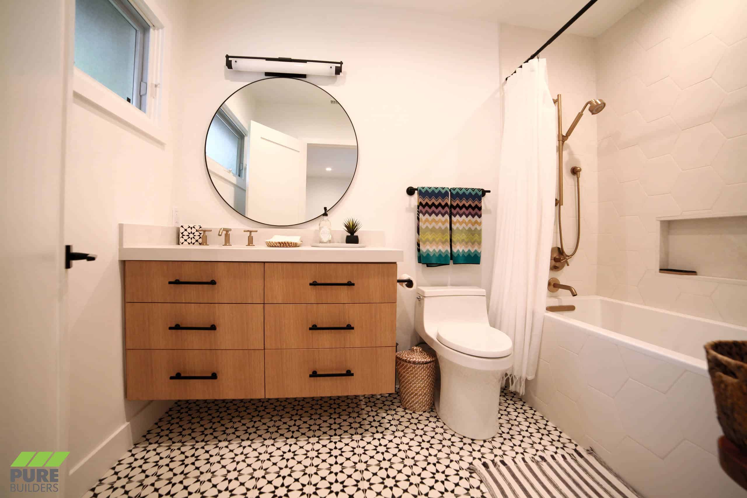 White honey comb tile walls, black and white pattern floor, wooden cabinets