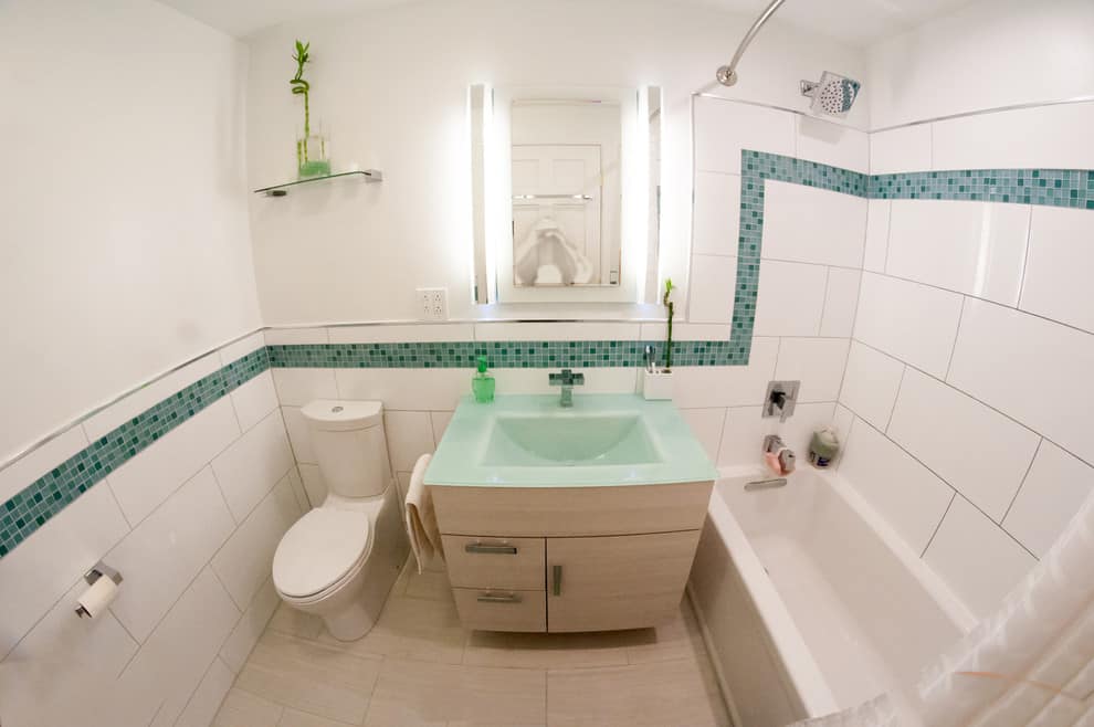 Beige tile floor, white tile floor with green mosaic decoration, green countertop