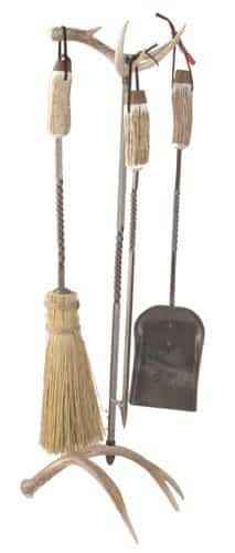 Standard antler fireplace set w/straw broom. Real deer antler base and top. Wrought iron tools. Stand 33"H Tools 23"long.