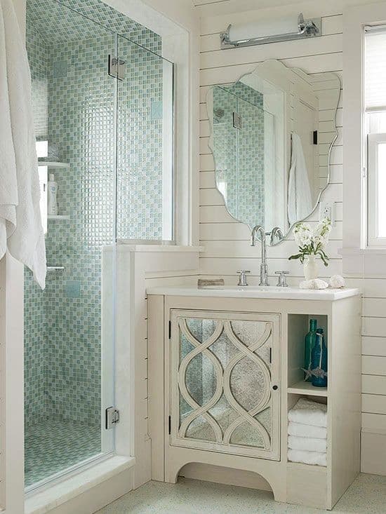 Walk-in shower, white walls, green mosaic tile shower