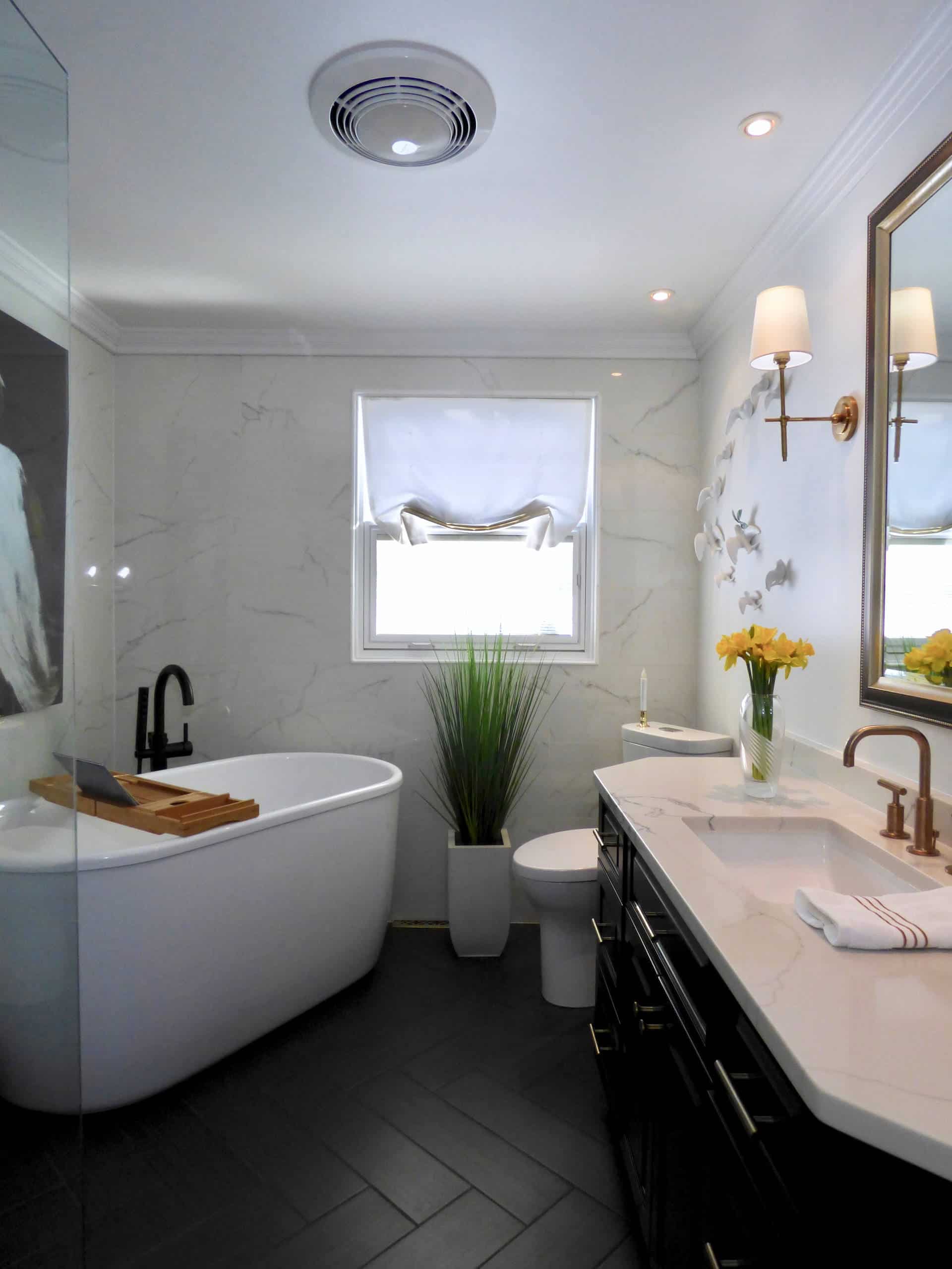 Black tile floor, black cabinets, white marble pattern walls