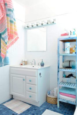 A Colorful Shelf Holds Towels for Use
