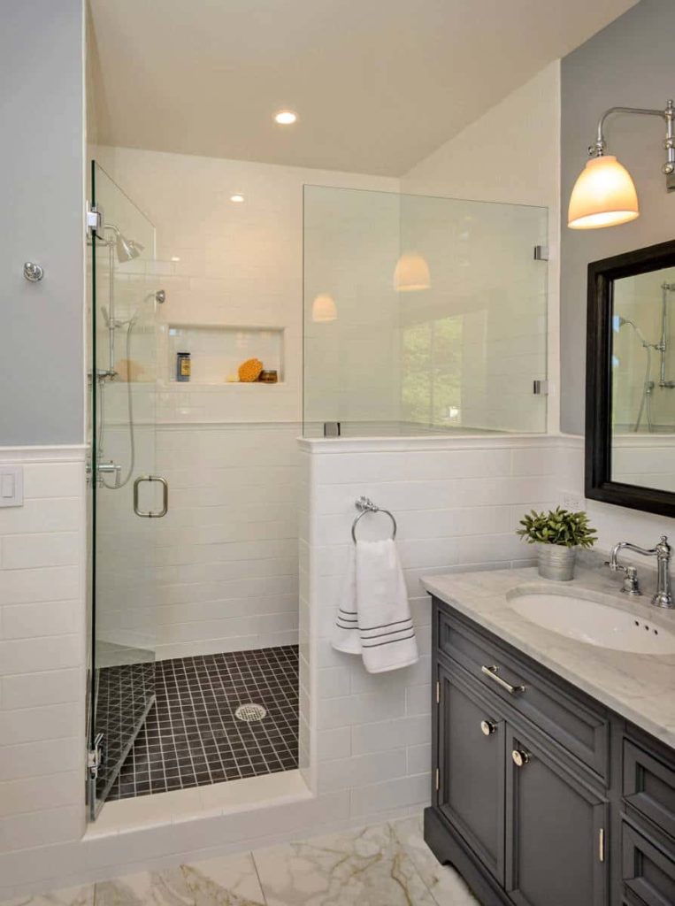 Alcove shower, white walls, black tile shower floor, black cabinets
