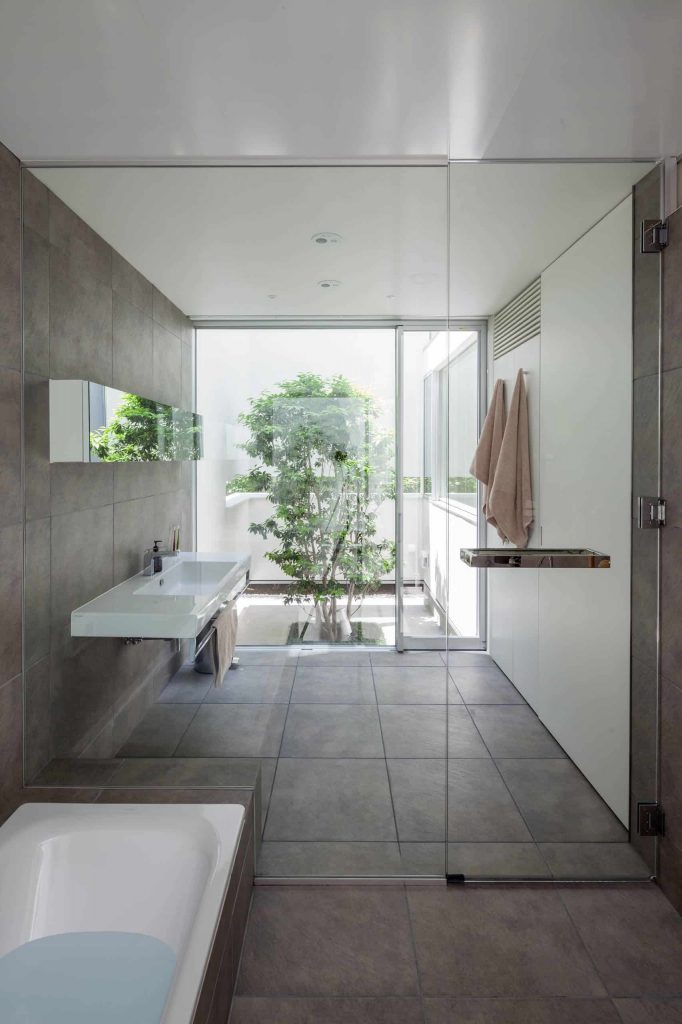 contemporary master gray tile bathroom idea in Yokohama
