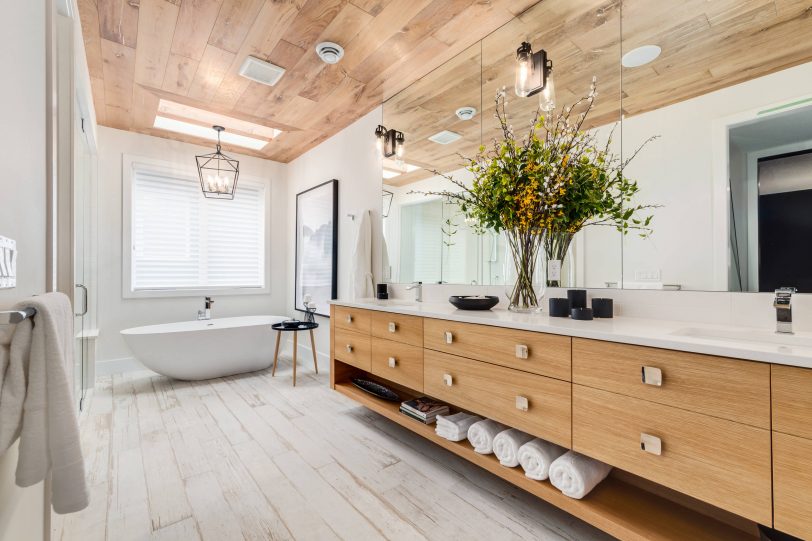 Bathroom - large contemporary master white floor and light wood floor bathroom idea in Calgary with flat-panel cabinets, light wood cabinets, white walls, quartz countertops, an undermount sink and a hinged shower door
