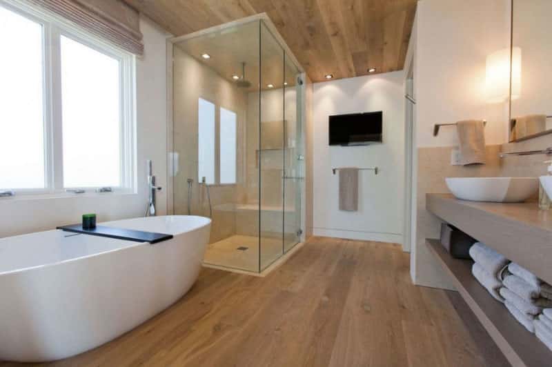 Inspiration for a mid-sized modern master beige tile and porcelain tile light wood floor and beige floor bathroom remodel in Orange County with open cabinets, beige cabinets, white walls, a vessel sink, quartz countertops and a hinged shower door